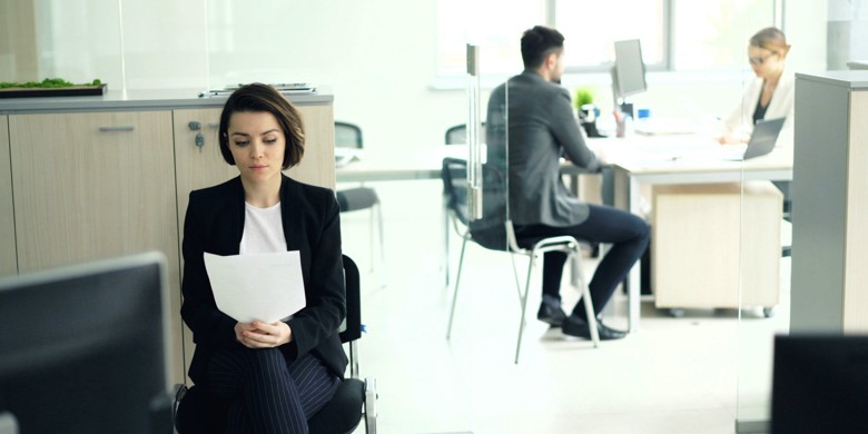 Woman waiting in line in an office