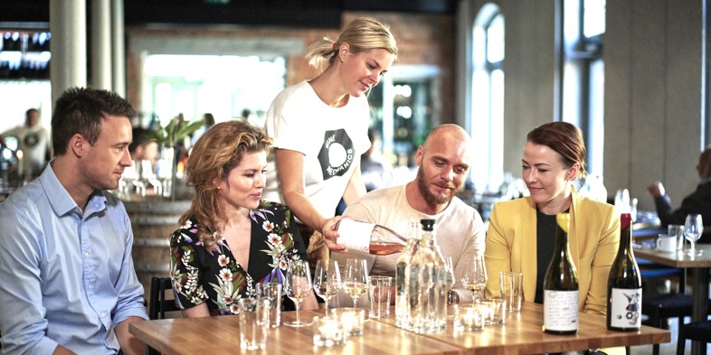 Waiter serving wine at a restaurant