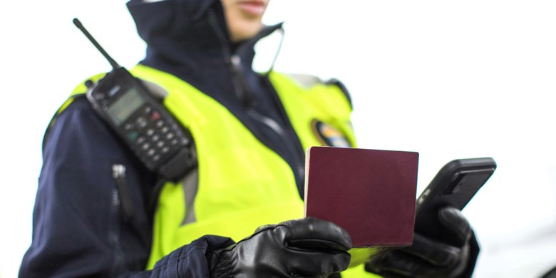 Police person checking passport