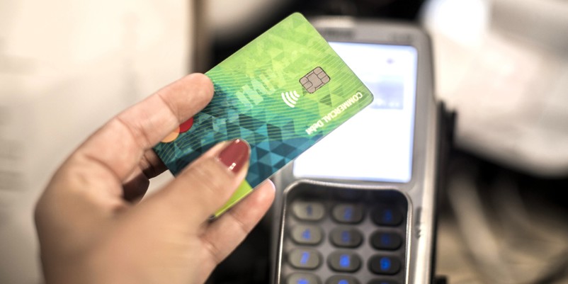 Woman paying with credit card
